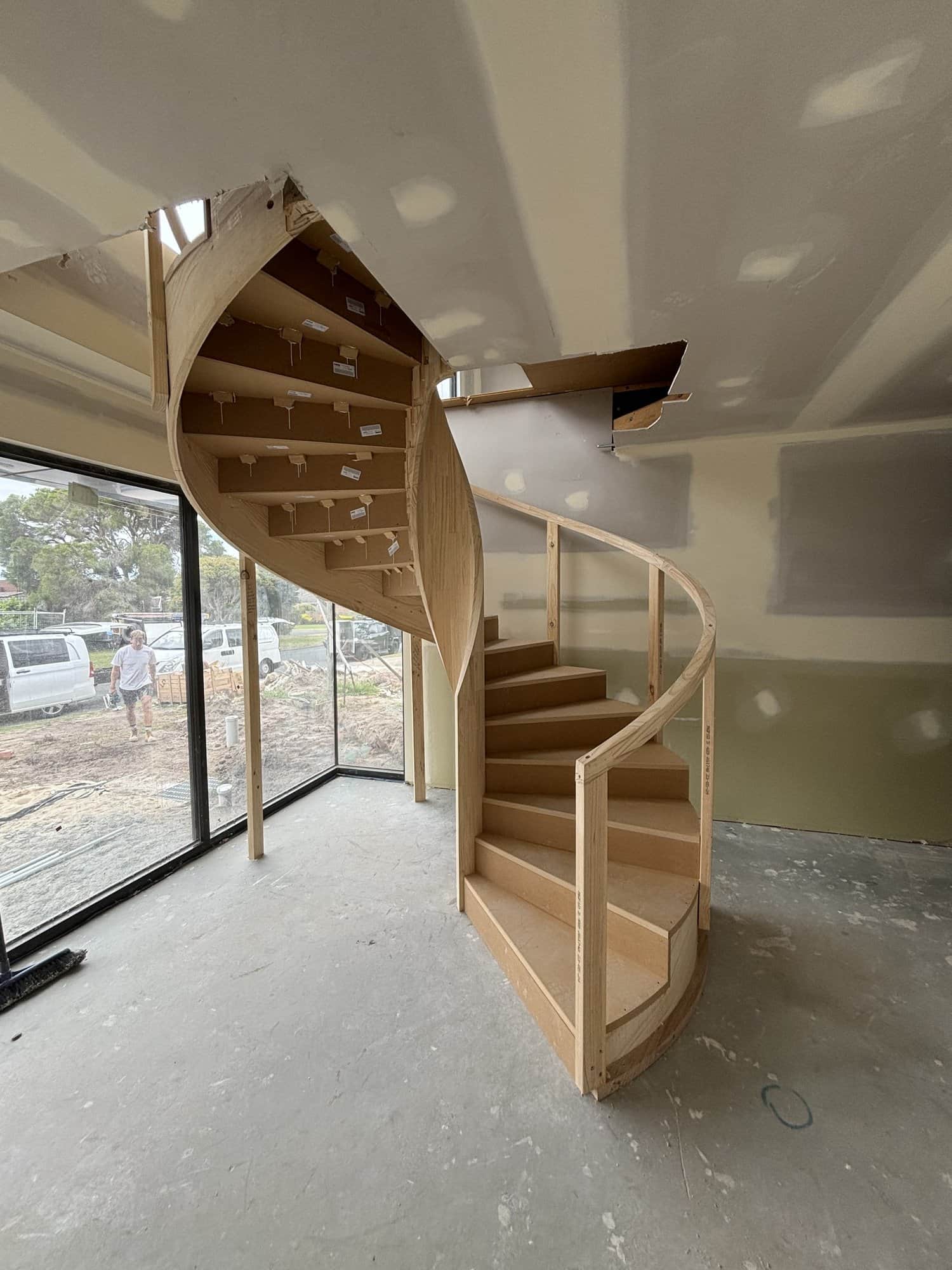 Sculptural sweeping spiral staircase in a Glen Iris new build