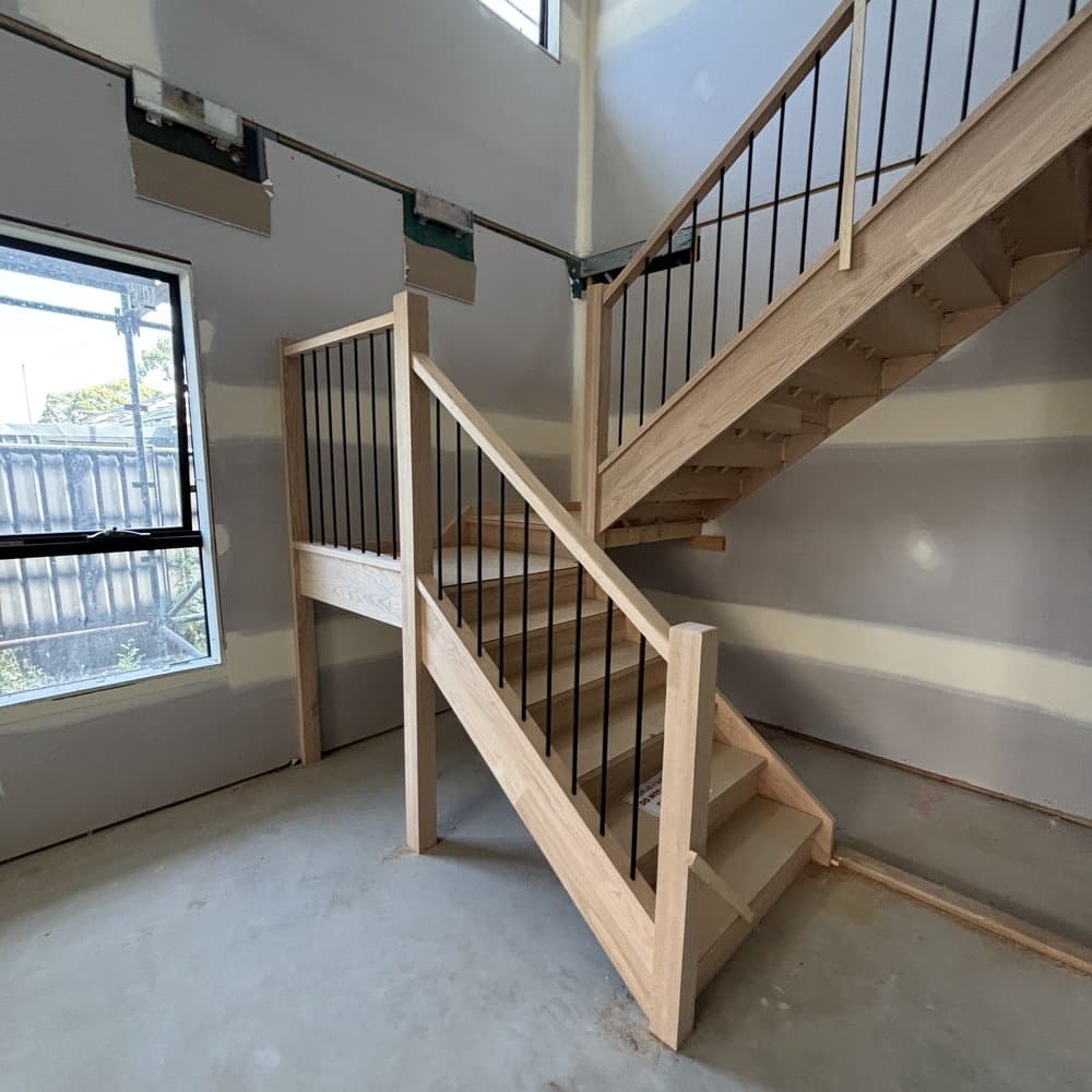 Multi-flight staircase in a high-ceiling new build
